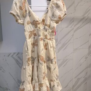 Yellow puffy dress with flowers and butterflies
